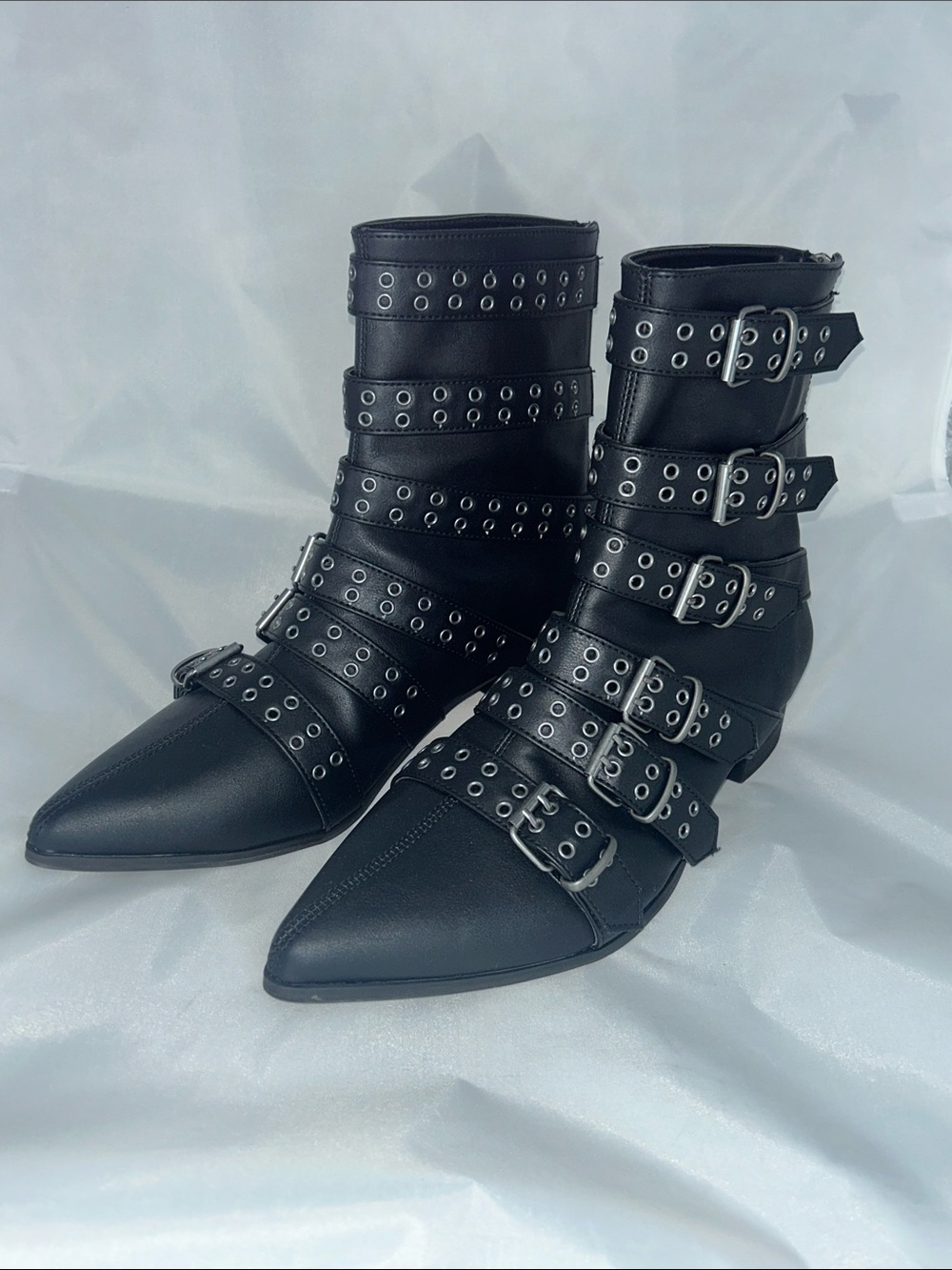 Demonia Black Pointed Multi-Buckle Grommet Ankle Boots
